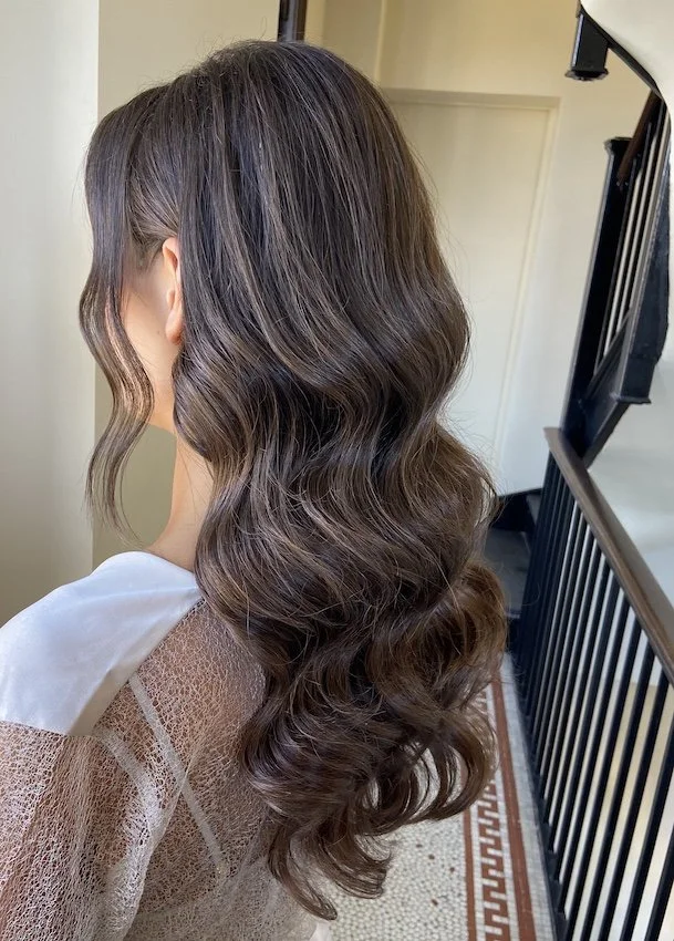 brunette bridal hairstyle with glam waves
