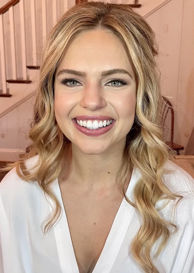 soft natural wedding makeup on a bride with blonde hair and blue eyes