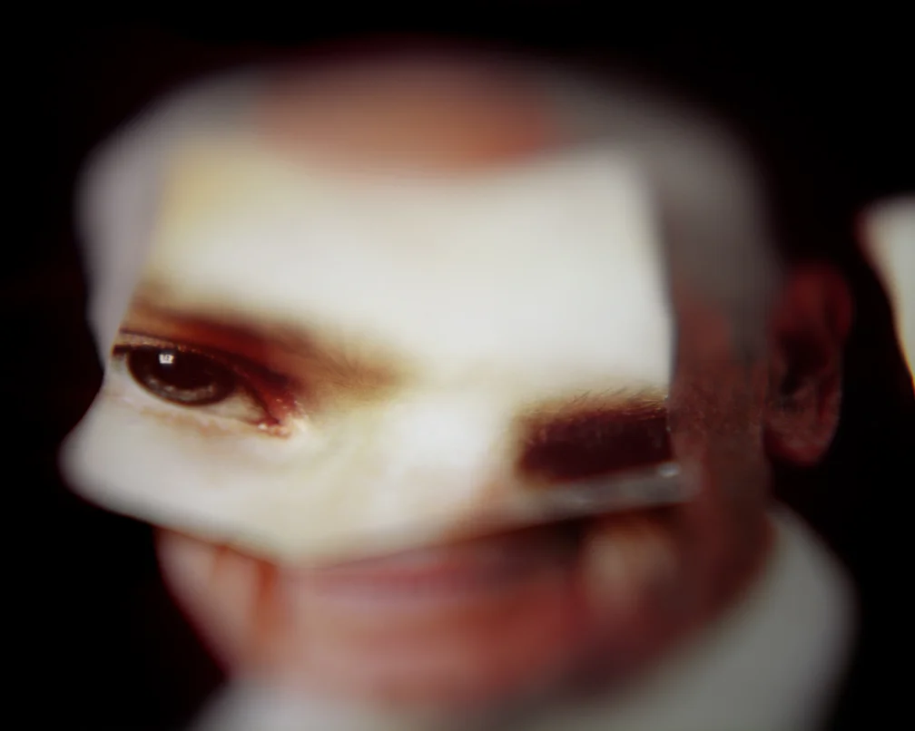 Composite image of man's smiling face with layered eyes, from Gravitas by Frederic Weber — featured in article by Jana Pijak.