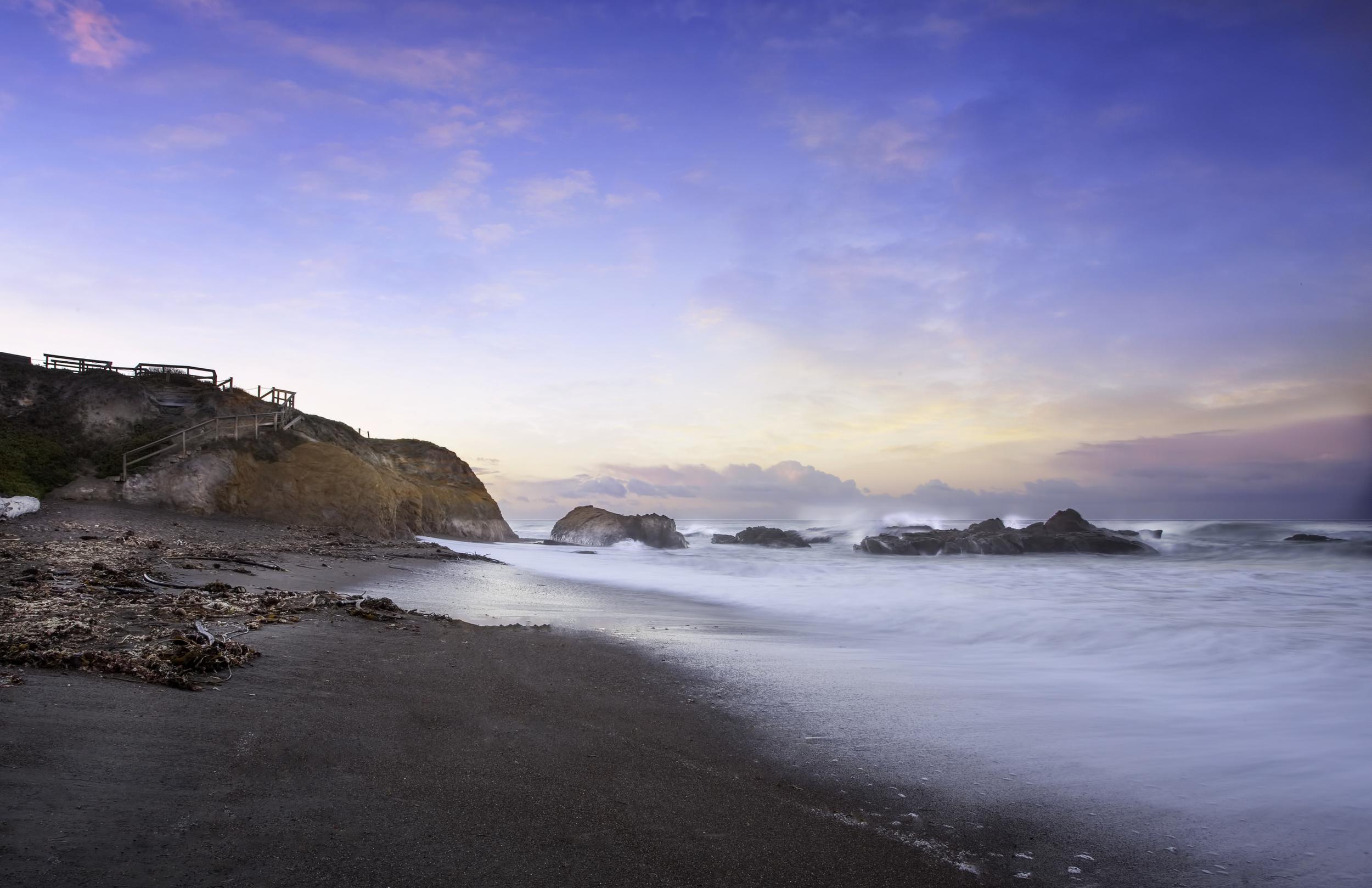 Stairway Water Splashing Off Rocks With A Colorful Sunrise In Cambria California