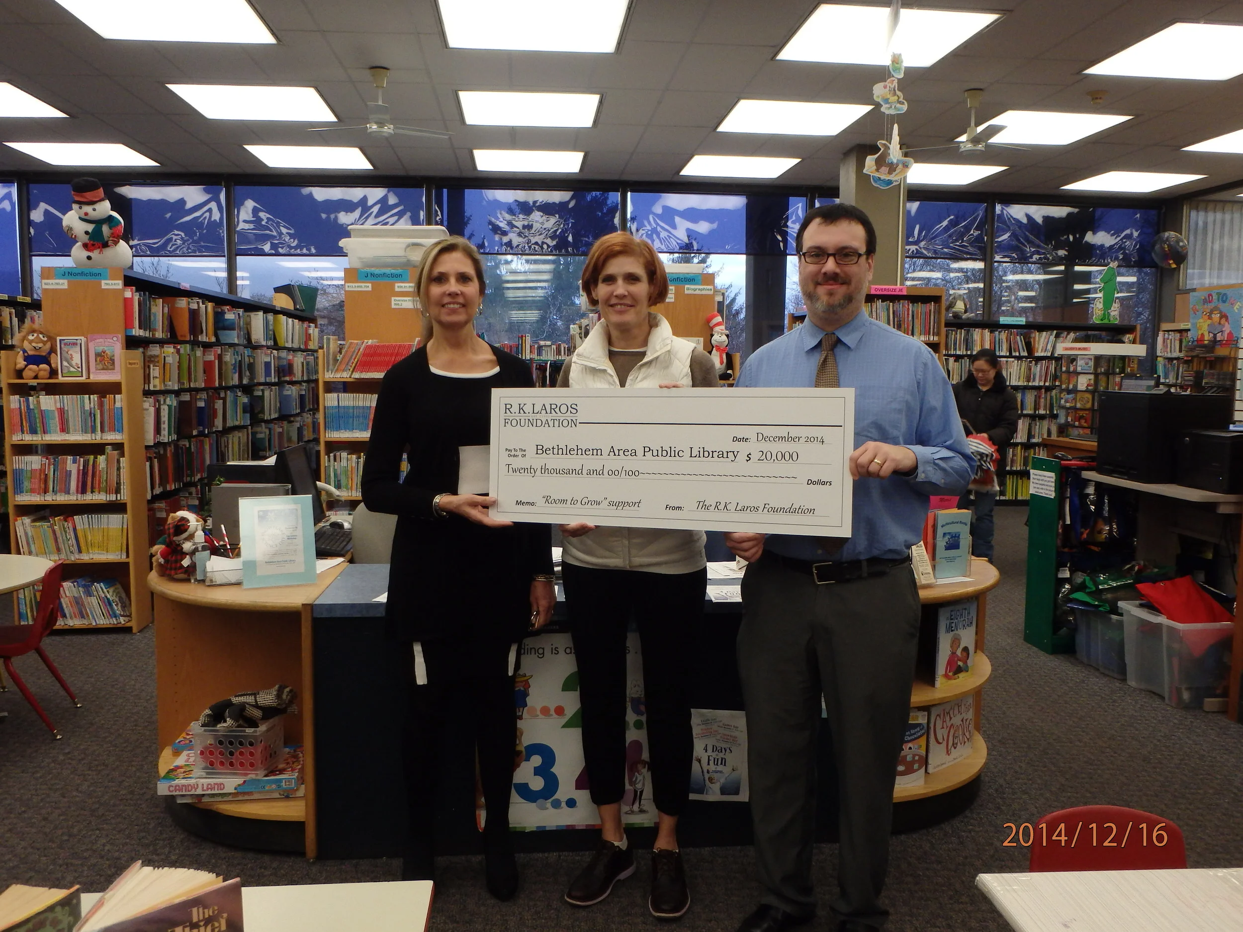 R.K. Laros Trustee Laura Bennett Shelton awards the Bethlehem Public Library Grant to Executive Director Josh Berk and Development Director Liza Holzinger supporting the "Room to Grow" campaign.