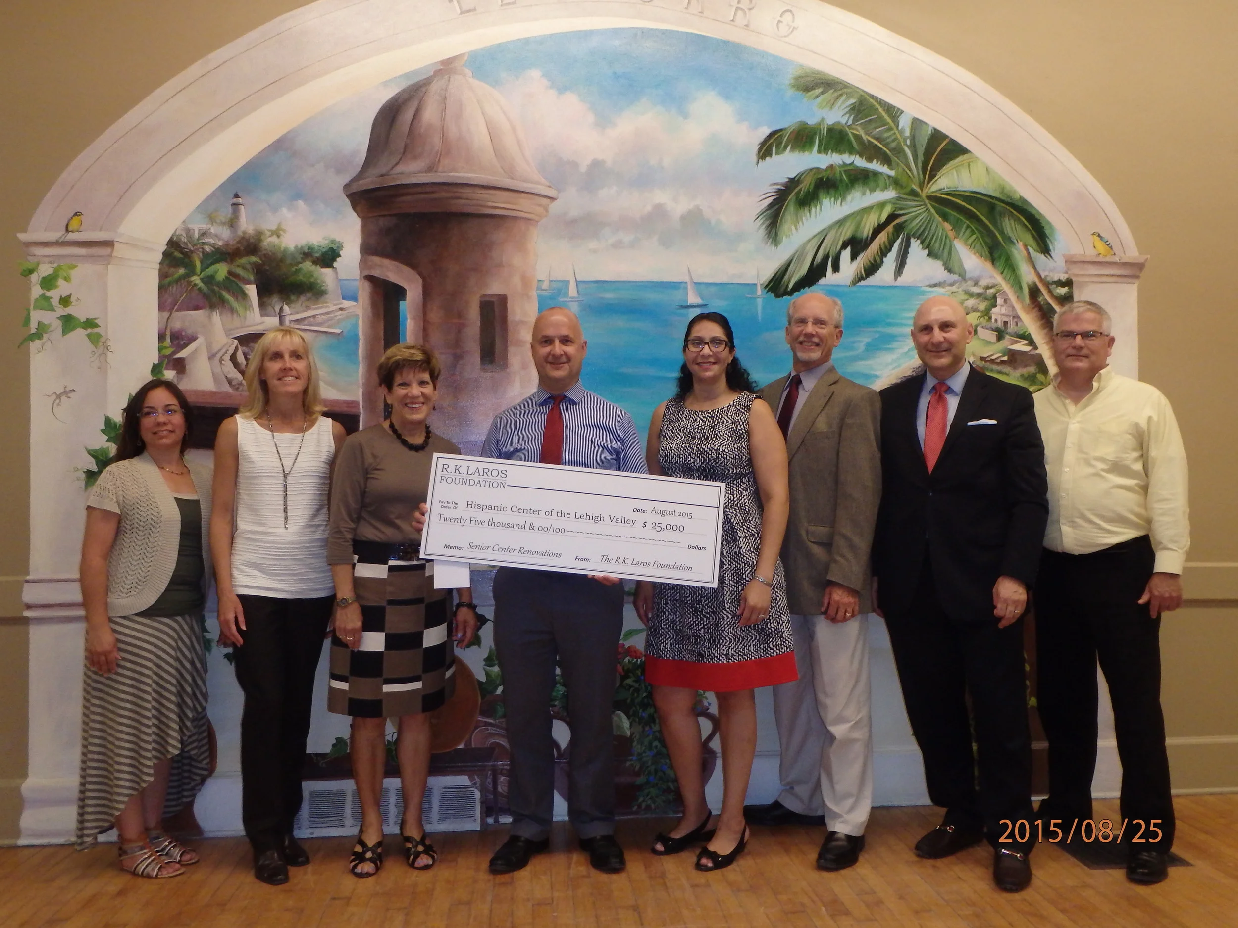Laros Trustee George Mowrer presenting R.K. Laros Foundation grant to the Hispanic Center of the Lehigh Valley.