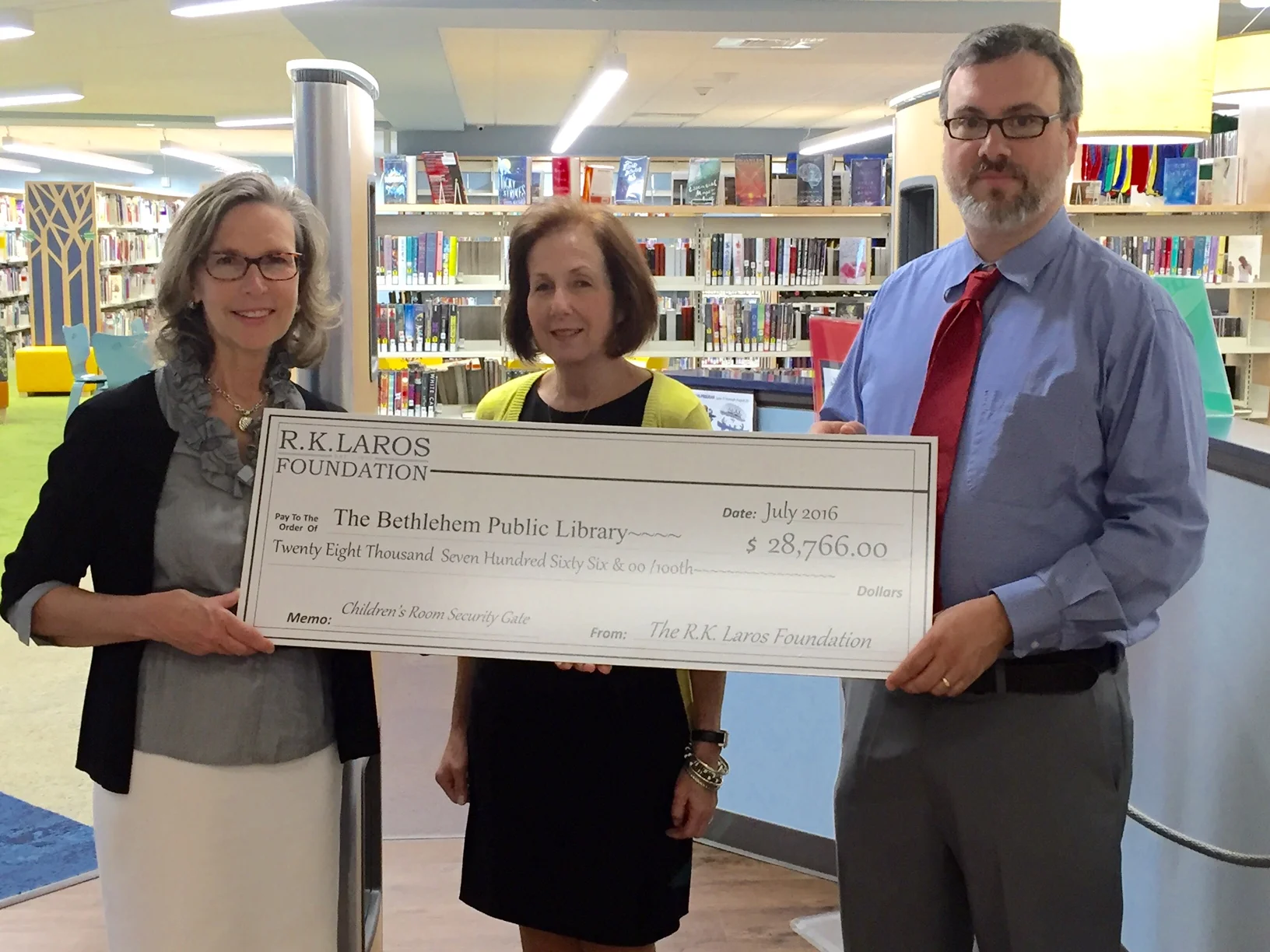 R.K. Laros Executive Director Sharon Zondag at Bethlehem Area Public Library with Head of Youth Services Dana Roy and BAPL Executive Director Josh Berk