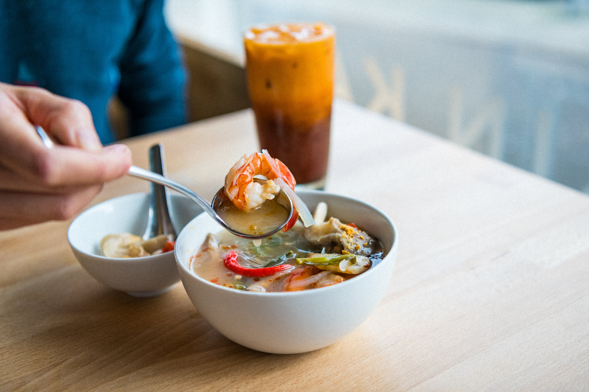   TOM YUM SOUP (GF)   choice of chicken or prawns: lime leaf, galangal, lemongrass, fresh red chilli, tomato, fish sauce, lime juice, shallots, oyster mushroom, cilantro, cilantro roots, fried garlic   SM 9 (12 OZ) / LRG 17 (24 OZ)  