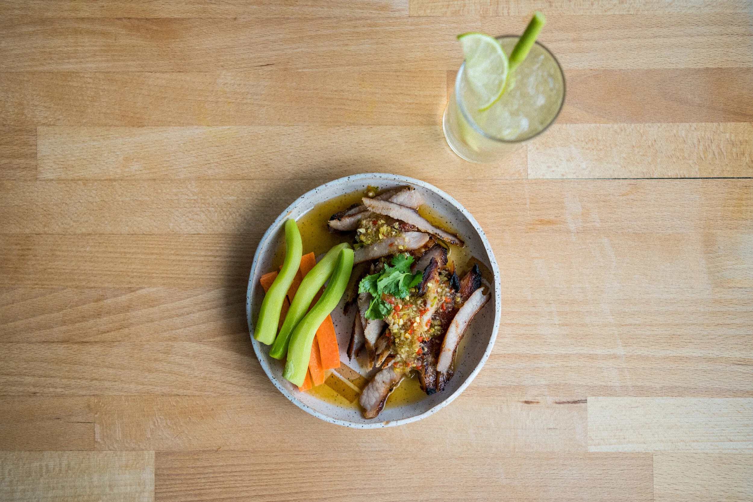   PORK JOWL - 12   chili lime dressing, chili, garlic, cilantro roots, fish sauce, lime juice, oyster sauce, black pepper. 