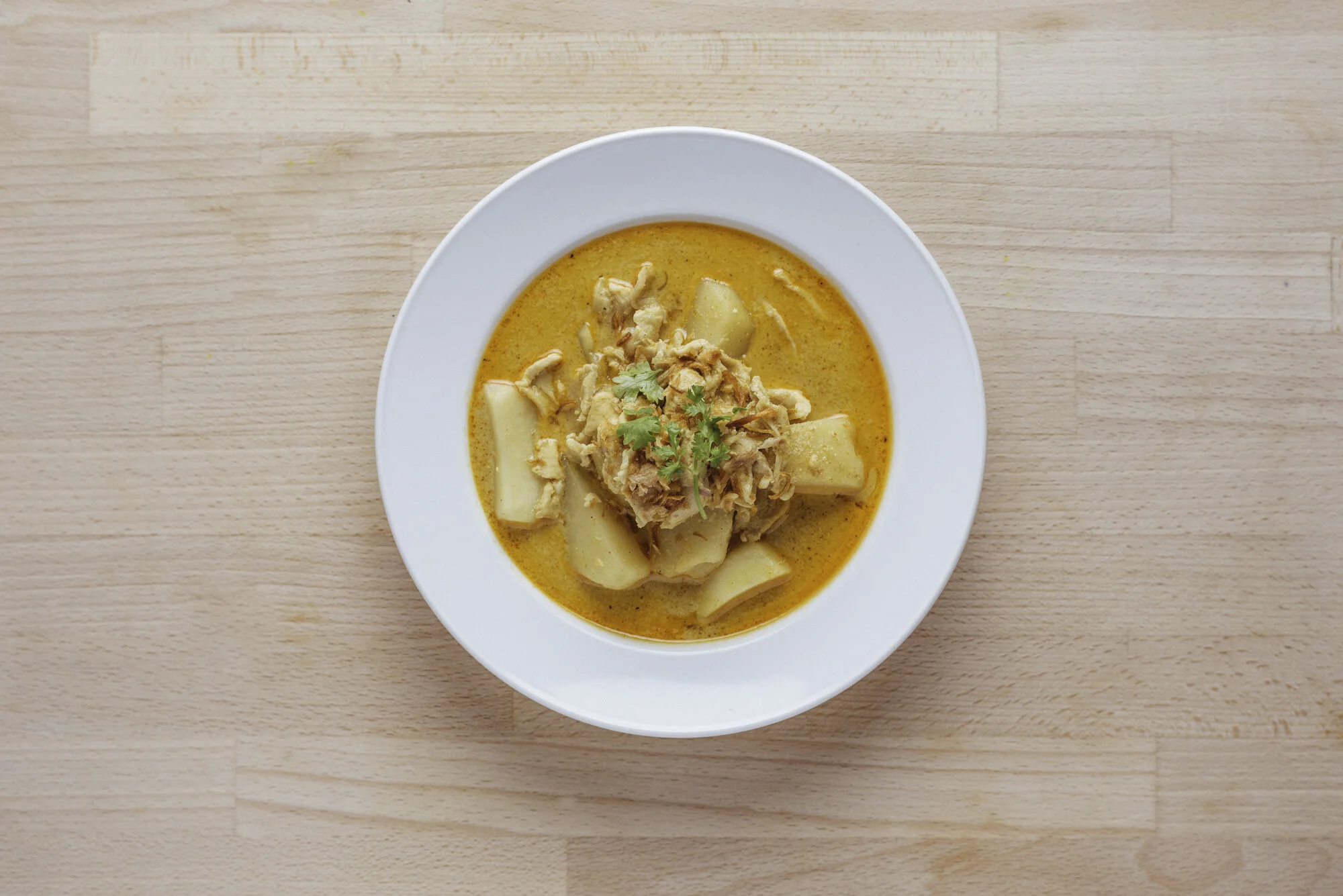   YELLOW CURRY (GF) - 16     choice of chicken or tofu (vegan)   with potatoes, coconut milk, chili, garlic, ginger, lime leaves, deep fried shallots, fish sauce 