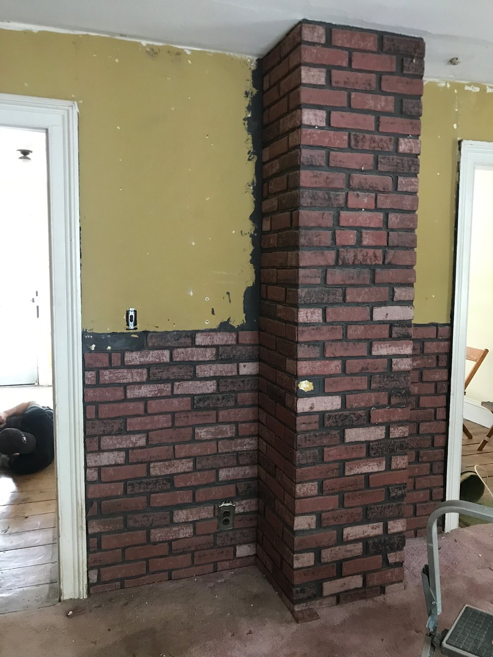 dining brick wall before.jpg