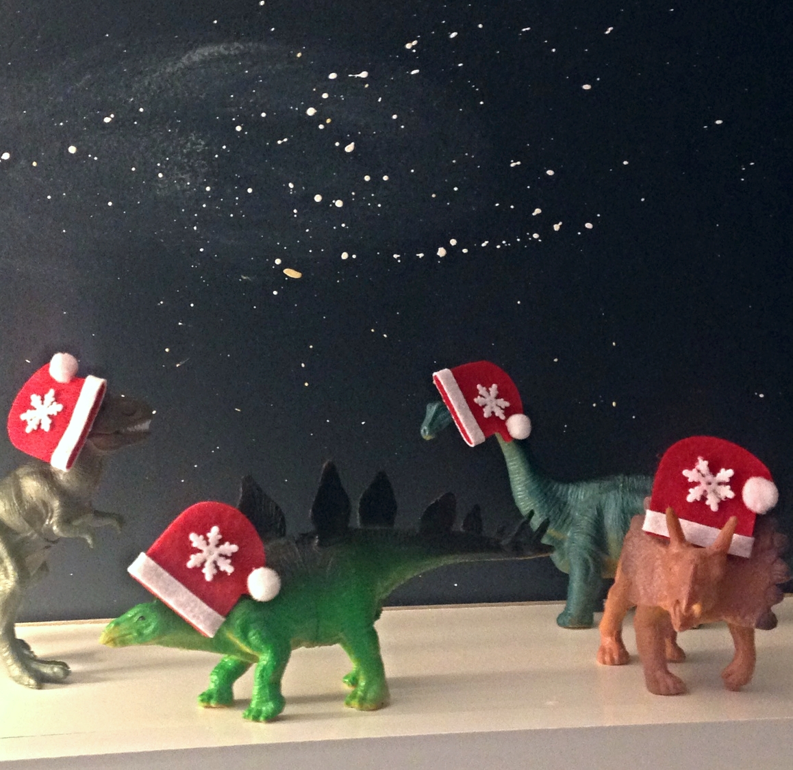 Tiny Santa hats available at Michael's. Tiny Dinys available at the Dollar Store. If you can believe that.