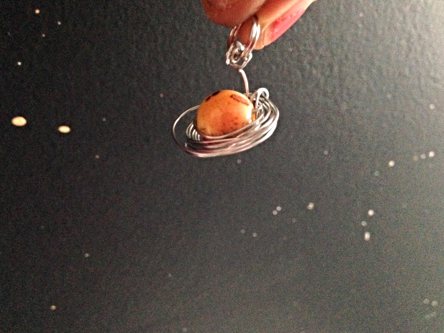 I wrapped the wire around one big bead and made a Saturn necklace, too. Then I took it's picture in my space bathroom.....because I rule.