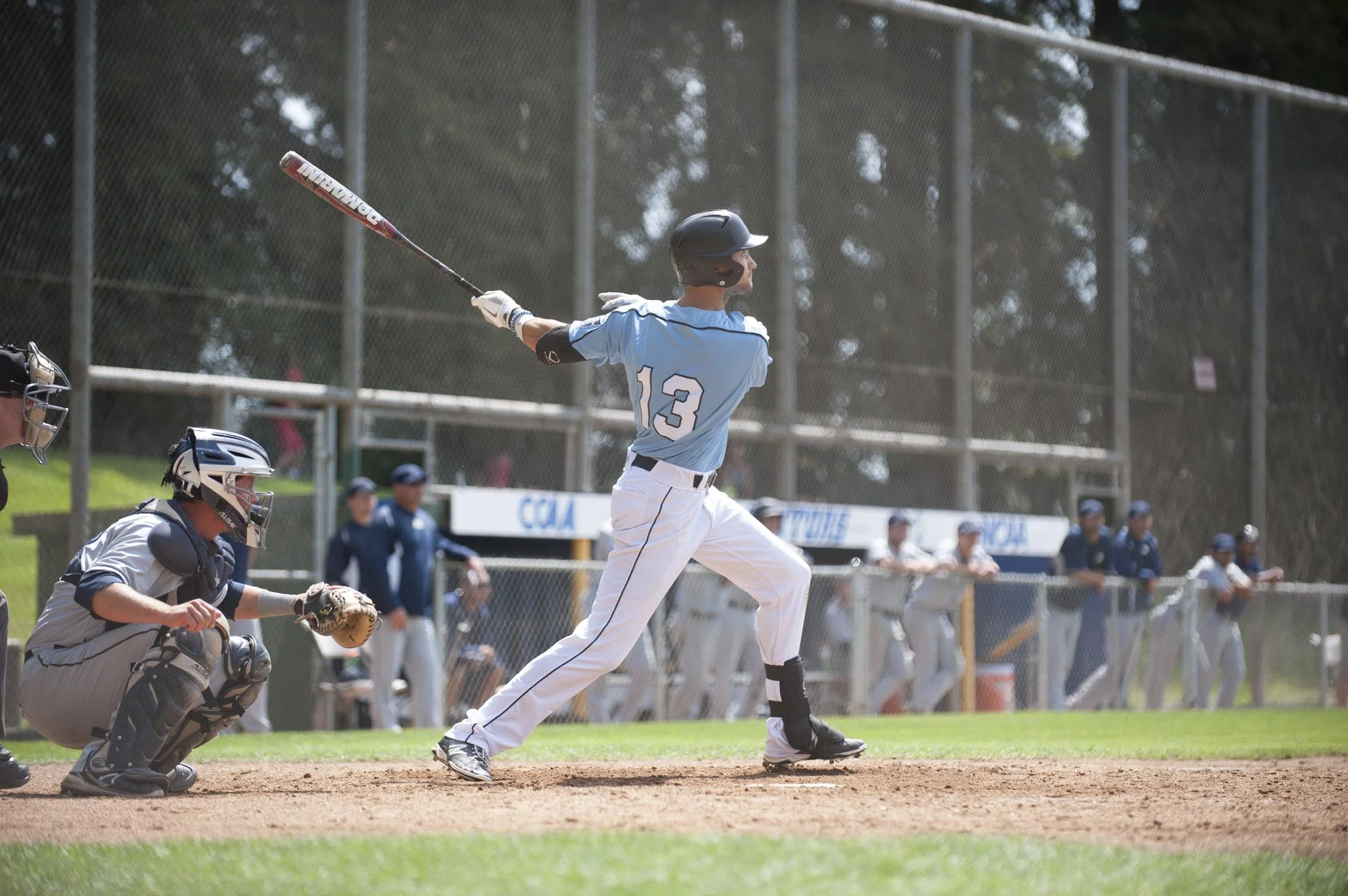 STAR // Connor Gibson Left, Wesley Wallace slams a hit. Right, Garrett Schwartz makes a run for home.