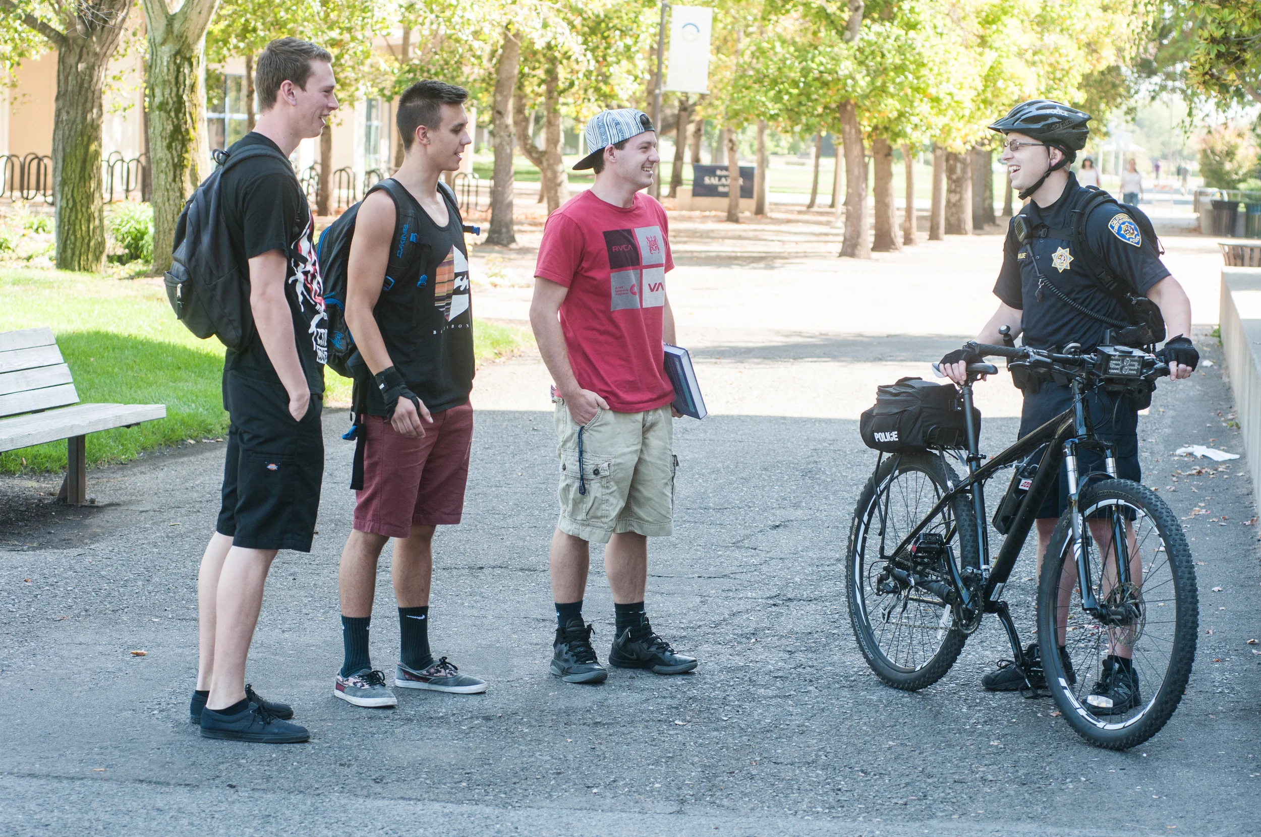 STAR // Gustavo Vasquez Sonoma State University Police Officer Eric Wilde talks to students about the implementation of the new bicycle patrol program.