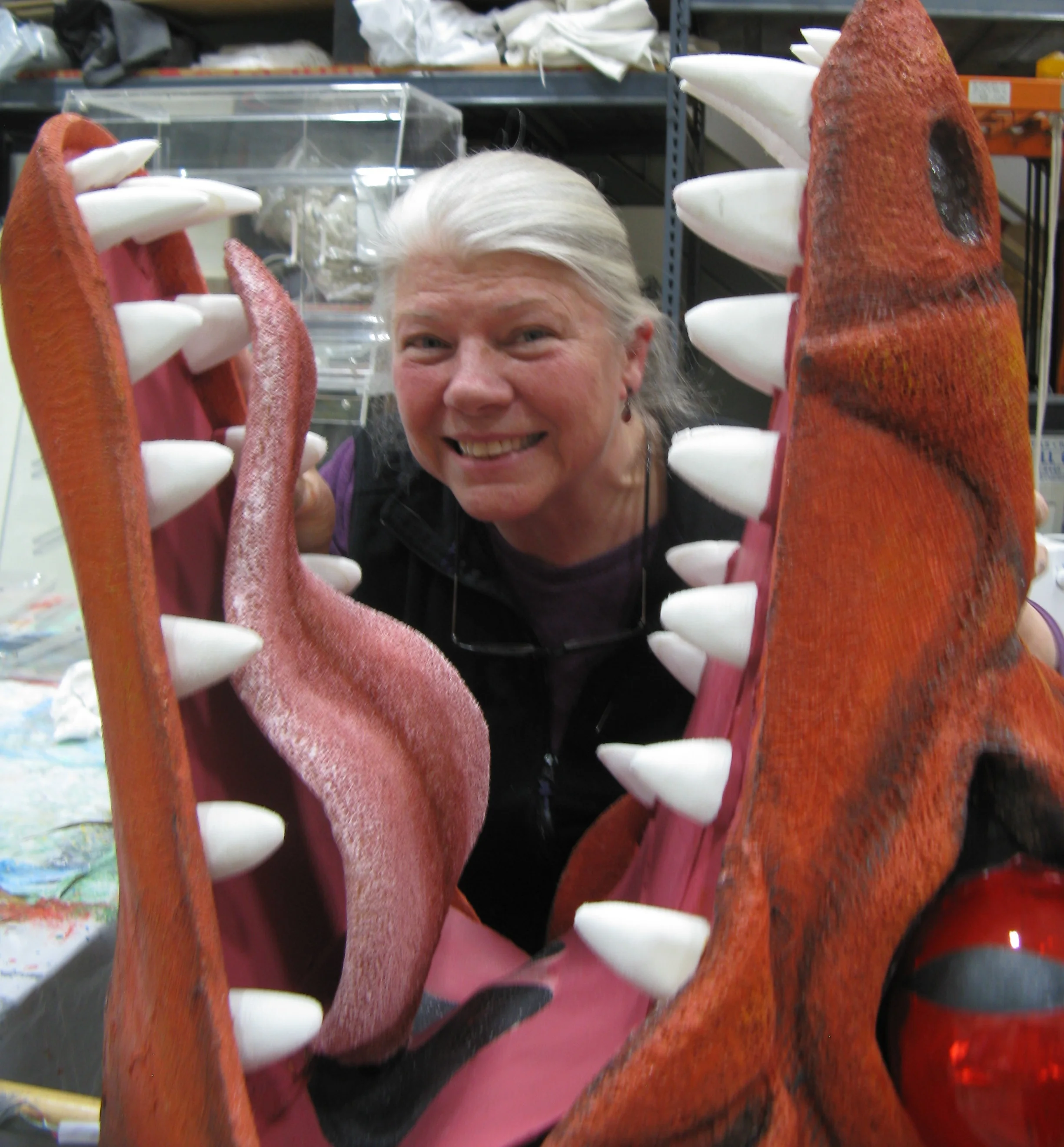 COURTESY // Michelle Dokos Sonoma County puppet master Mary Nagler poses with the dragon she helped make, Tiamot.