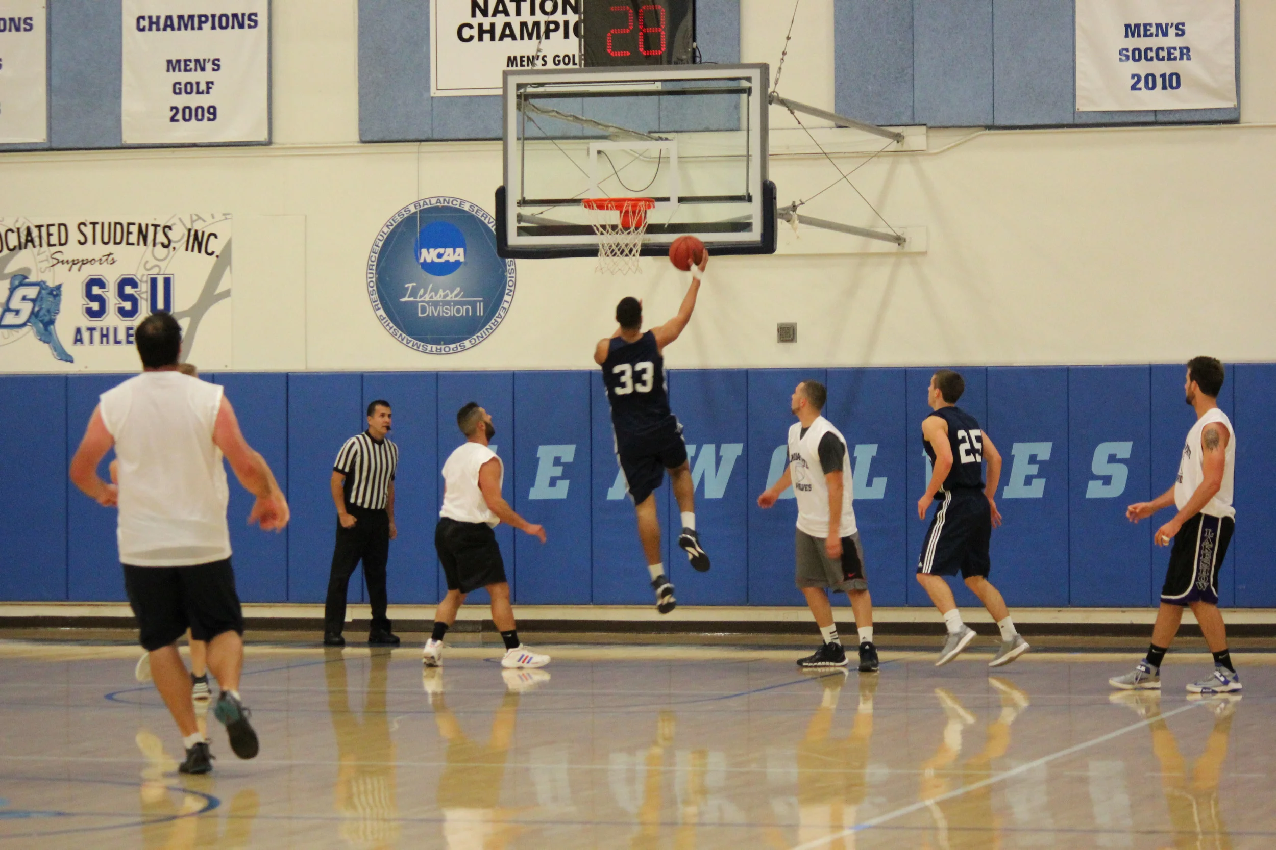 STAR // Sara Wildman Senior JJ Mina goes in for a layup against the alumni.