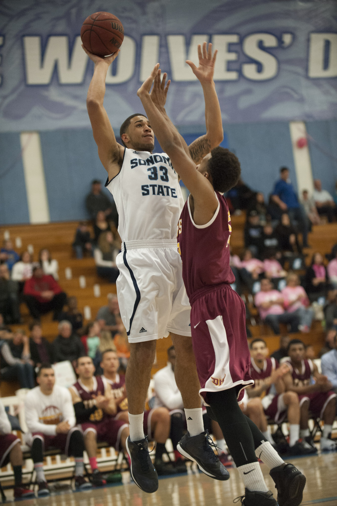 STAR // Connor Gibson Left/Middle: Senior JJ Mina and Junior James Davis rise above defenders as they lead the team in scoring with 18 points each. Right: Sophomore Nathan Molony-Benjamin contributed in the paint.