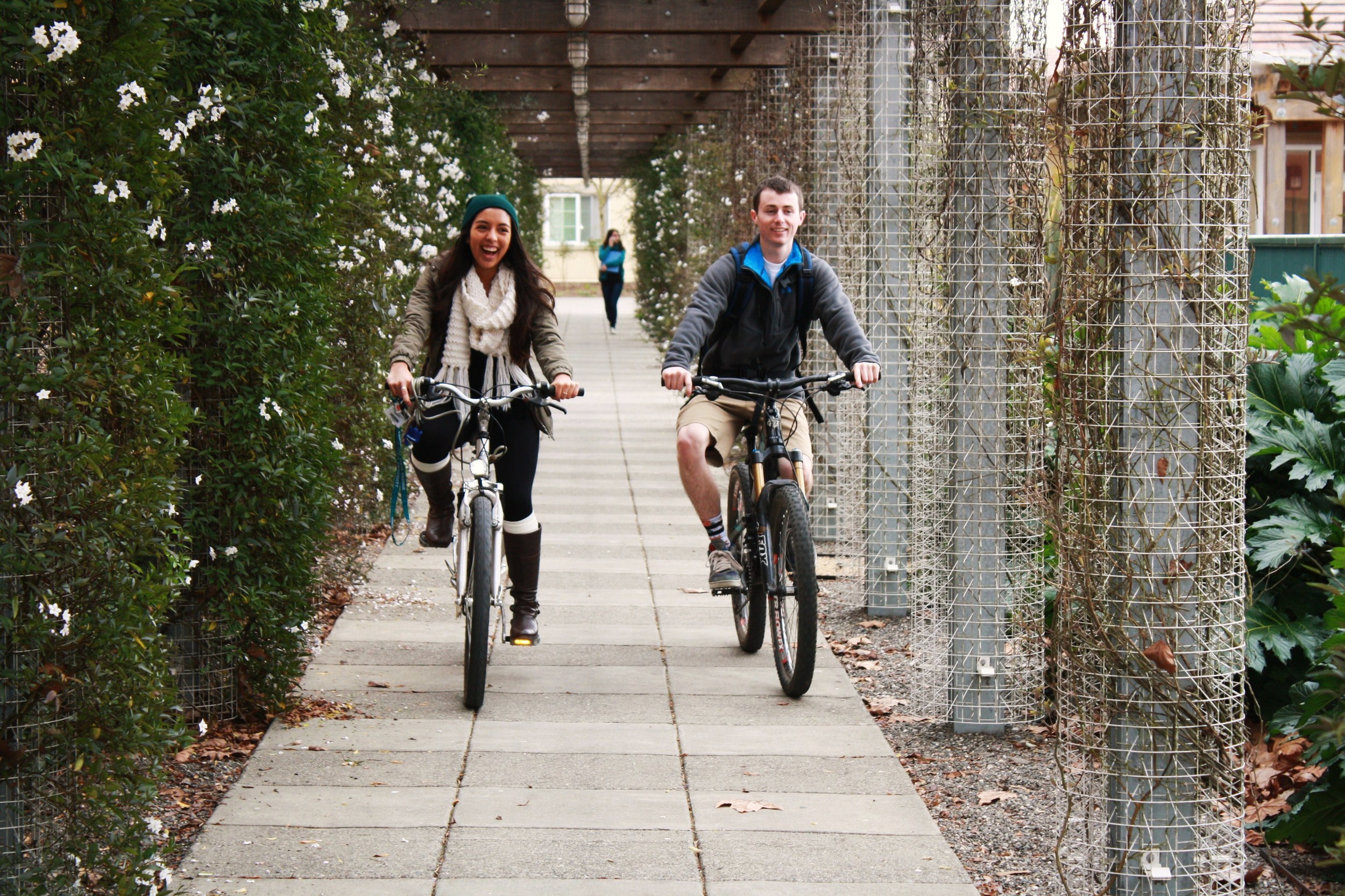 STAR // Niquie Wilson Breanna Pereira, 19, rides her bike home with her friend Josh Krisman, 20 on Thursday.