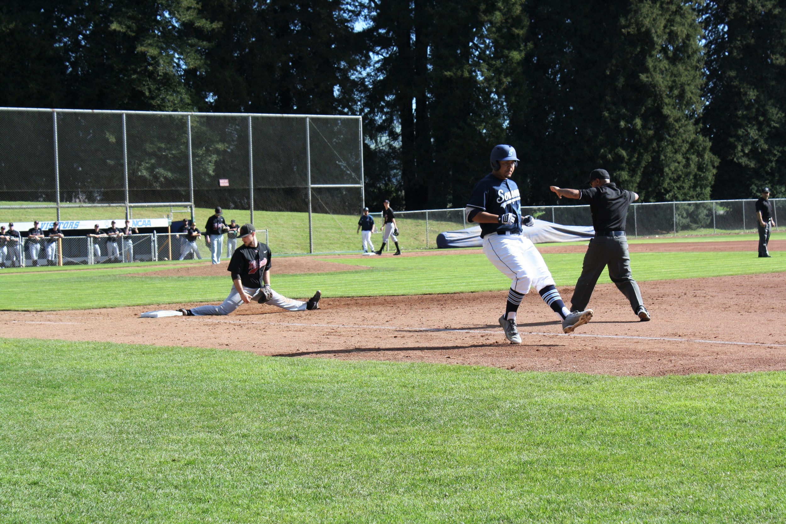 STAR // Niquie Wilson Left: Senior infielder Alex Crosby reaches base after beating out the throw. Right: Junior outfielder Dustyn Macaluso throws in-between innings.