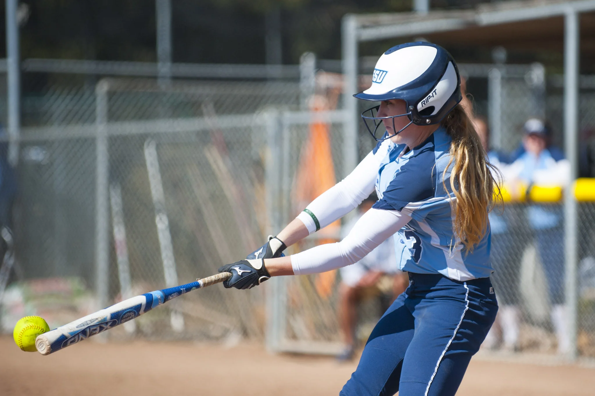 STAR // Connor Gibson Junior pitcher Amanda Llerena finishes her motion versus CSU Dominguez Hills. Senior outfielder Keeley Ray makes gets a piece of the ball in her at bat.