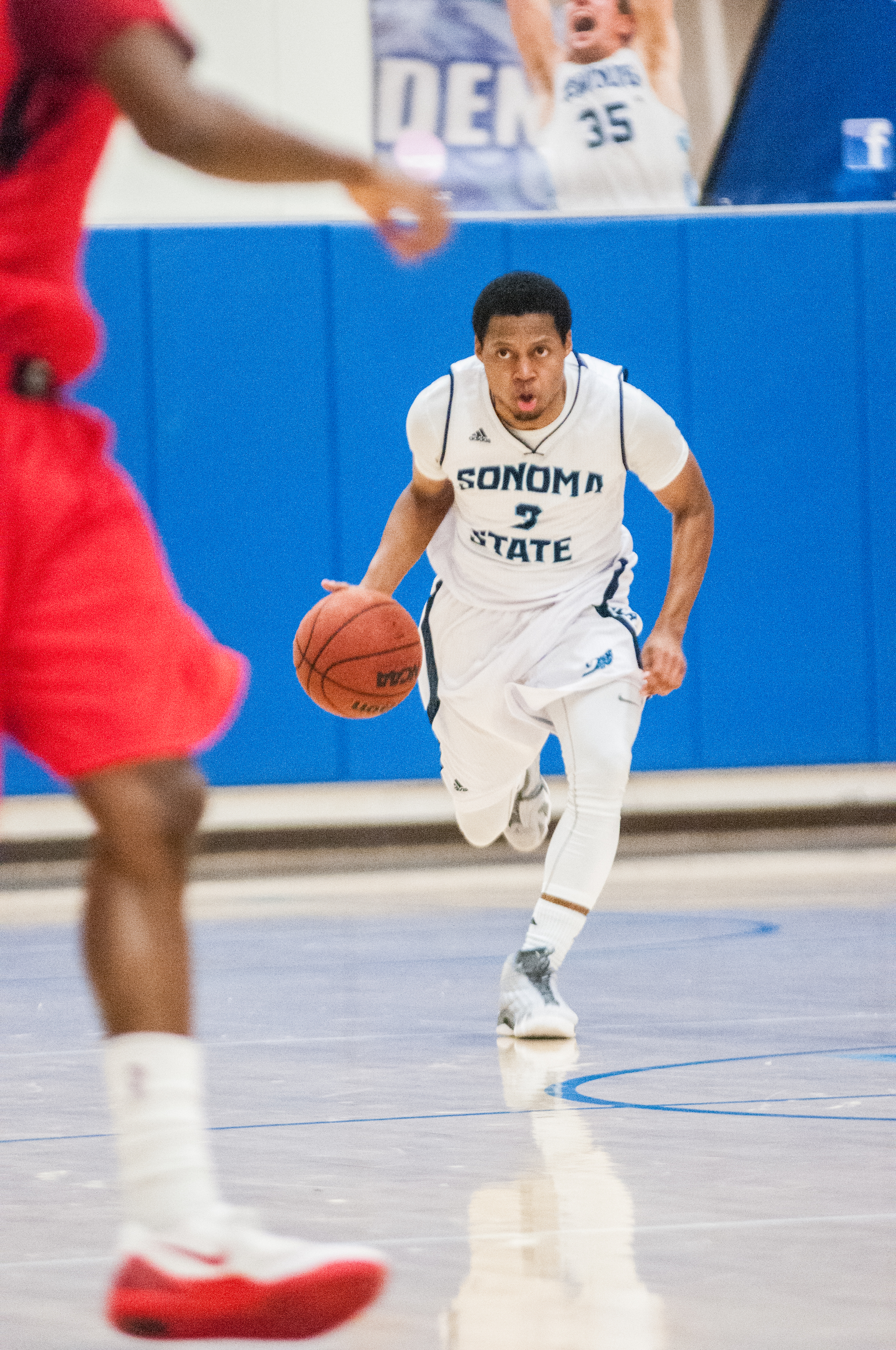 STAR // Gustavo Vasquez Junior forward Andy Mitchell grabs a rebound, sophomore guard Khalid Johnson takes the ball up court. Sophomore center Nathan Molony-Benjamin fights for a rebound, Johnson controls the offense.