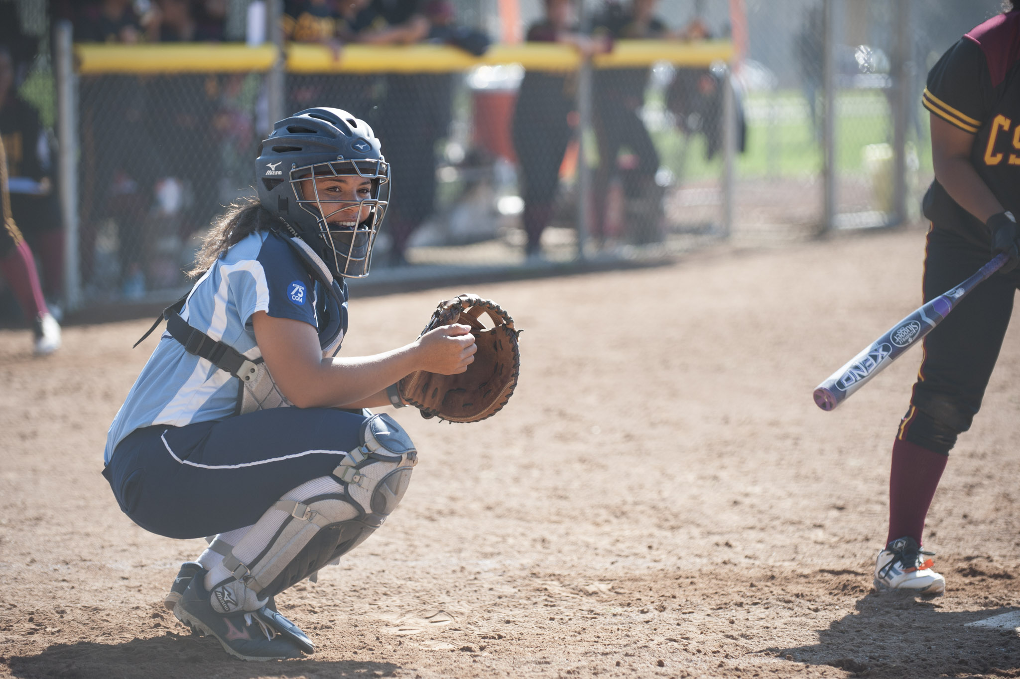 sonomaseawolves.com, STAR // Connor Gibson Junior catcher Aubrie Tolliver looks into the Seawolves dugout earlier this year.