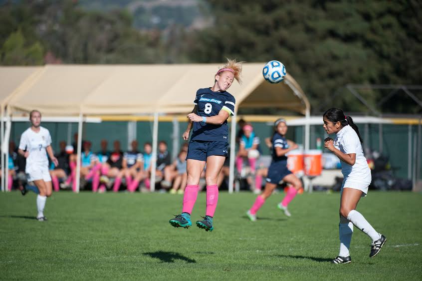 Senior Margi Osmundson successfully lands a header. 