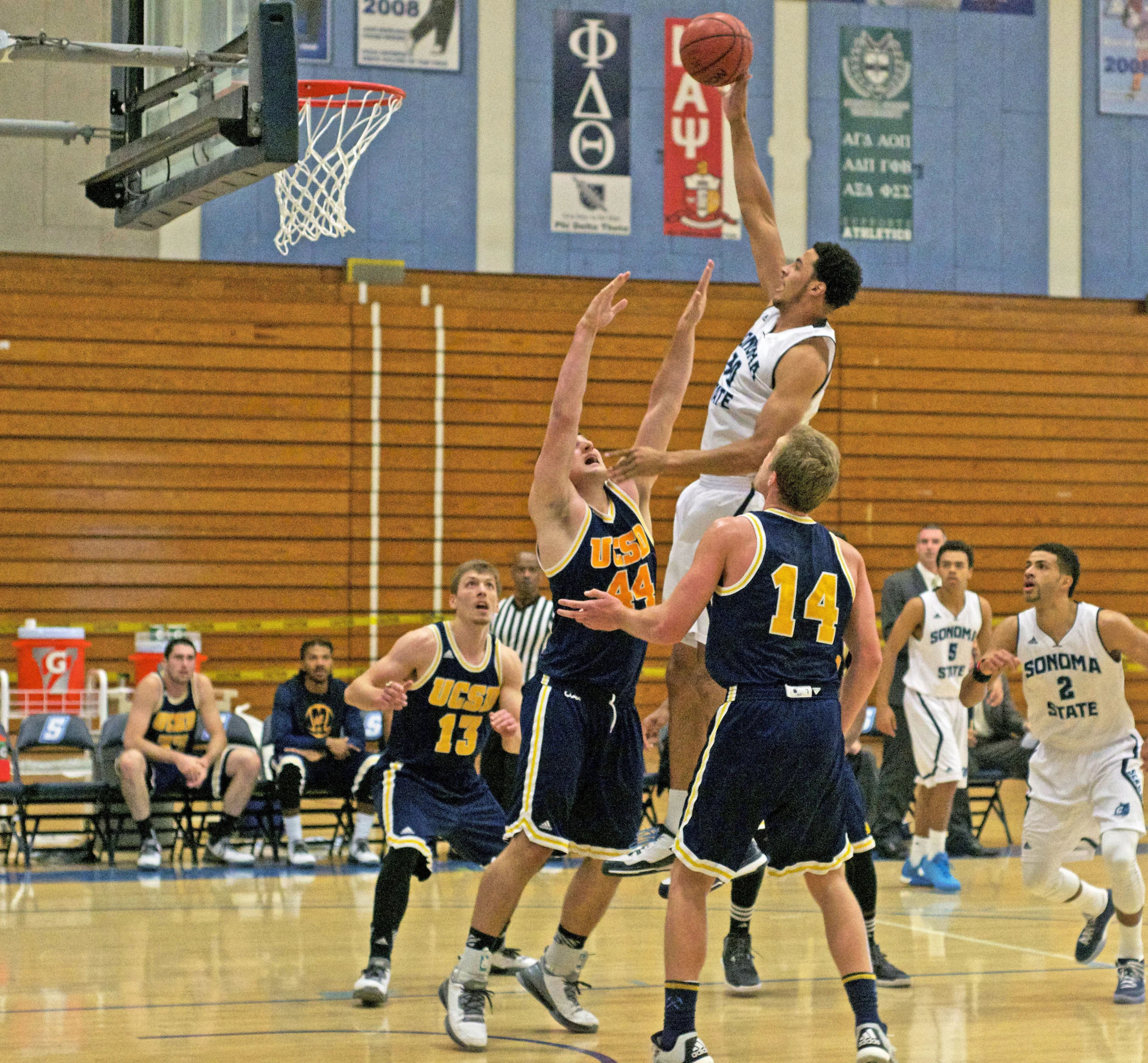 STAR// Nicole Detmers Junior Naaman Hightower, 34, drives the ball inside against visiting UC San Diego.