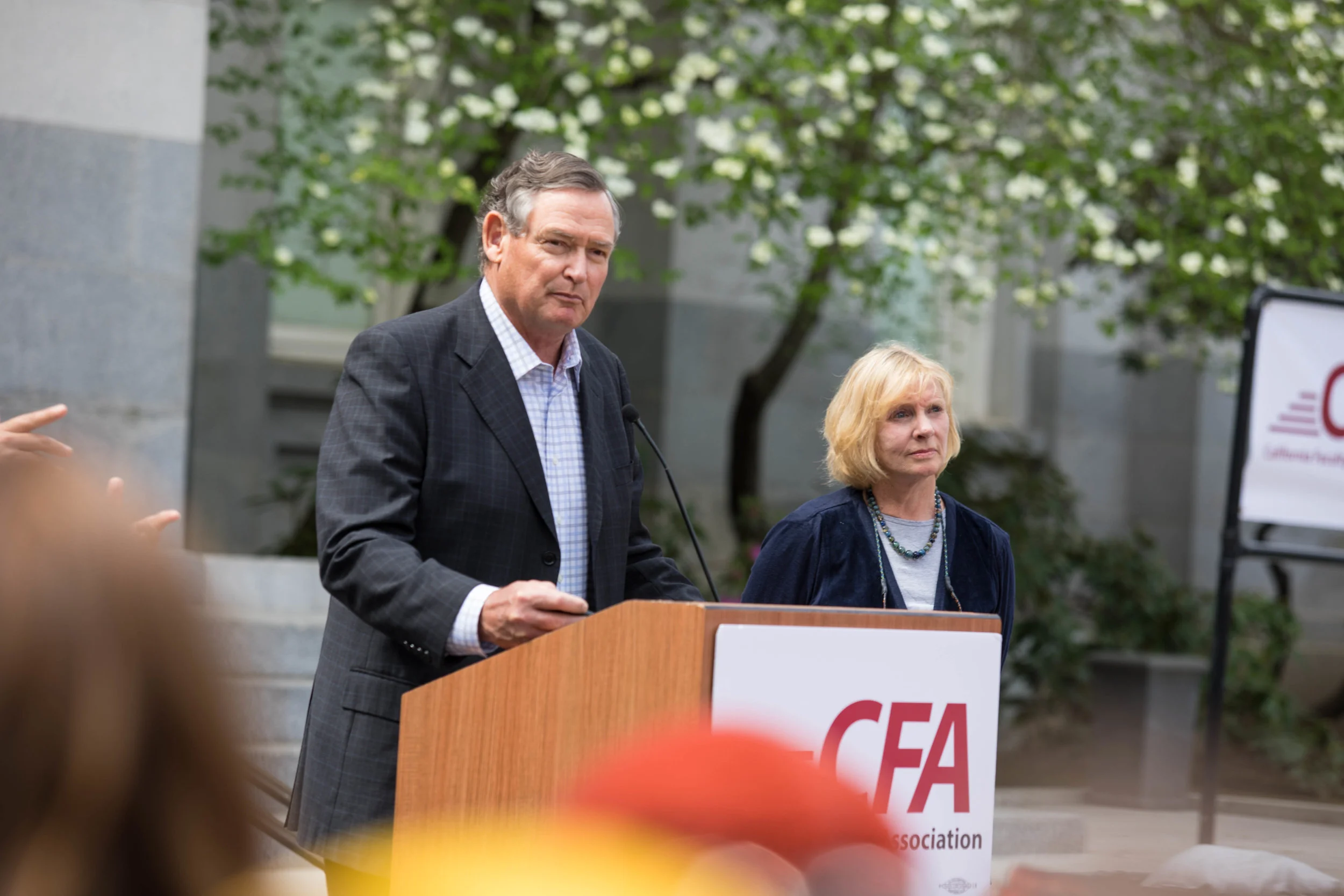 (top) CSU Chancellor Timothy White speaks to the crowd at the “Free the CSU” march on April 4. (bottom) SSU students protest a possible tuition hike at the “Free the CSU” march. Sonoma State STAR // Alyssa Archerda