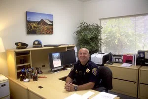 STAR // Analy Bravo Univeristy Chief of Police David Dougherty smiles at his desk last semester.