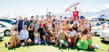 STAR // Gabriella Novello Sonoma State students, alumni and their inflatable tootsie roll named Teresa pose for a group picture at the first weekend of Coachella on April 12 in Indio, California.
