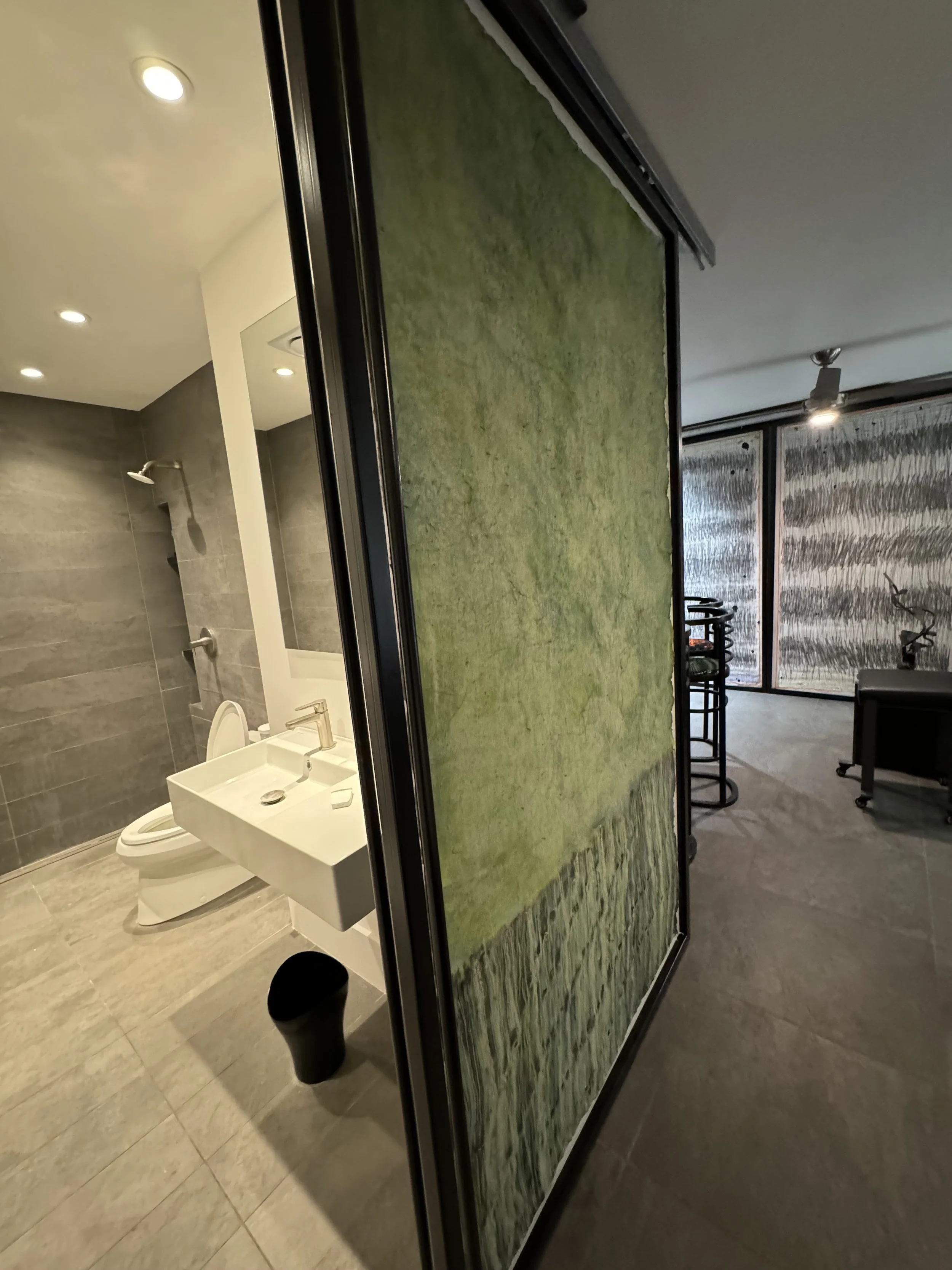  Installation of sliding doors with artwork  Door shown in open position to bath on left 