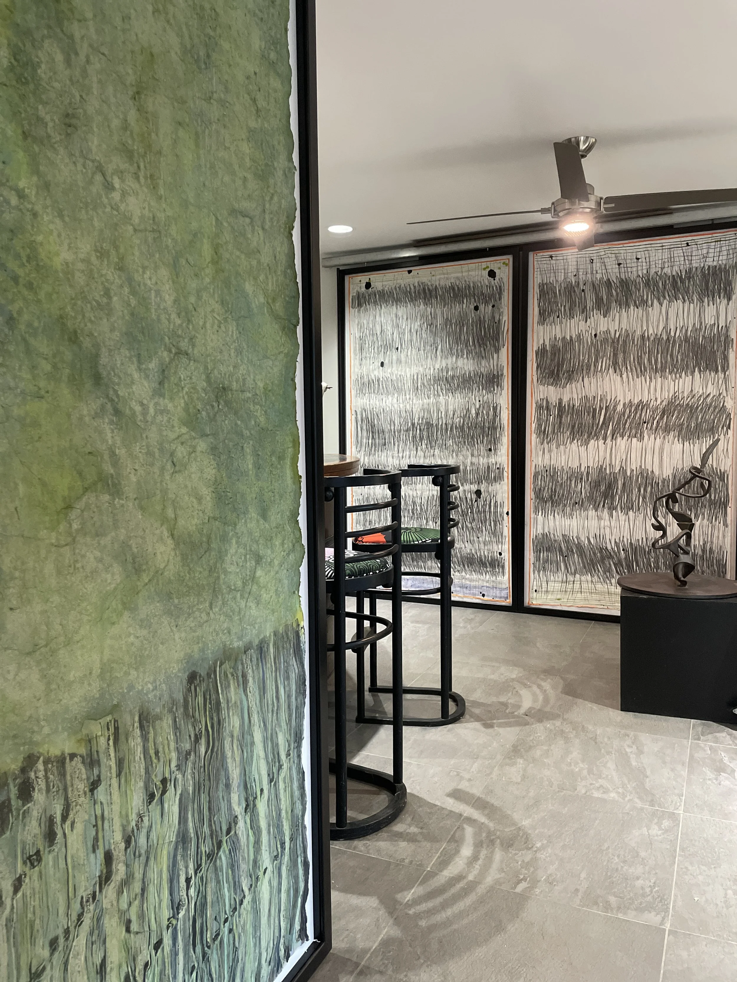  Installation of sliding doors with artwork  Green Field with door panels in closed position 