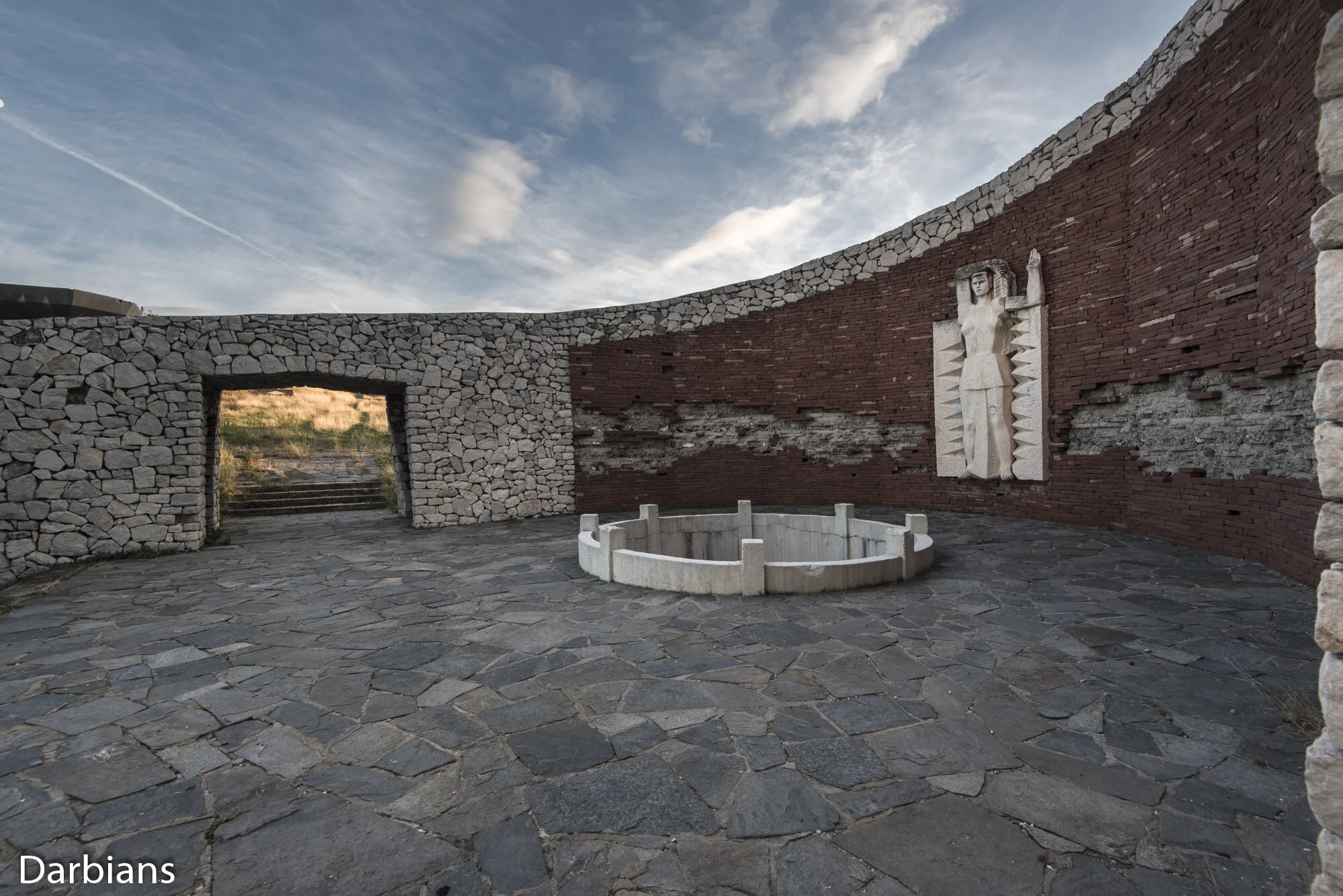 Monument Of The Three Generations: The statue seems to stand guard over the faux tomb.
