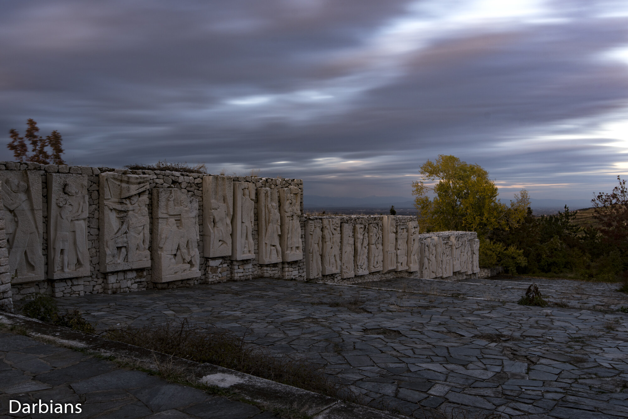 Monument Of The Three Generations: The juxtaposition of the stone structure with the more socialist like statues.
