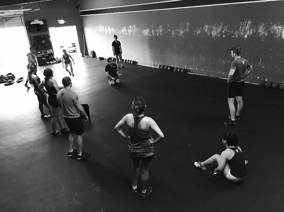 Explaining and Demonstrating the Sand Bag Get Up. When the athlete understands the "why" they are more capable of embracing what we ask them to do. 