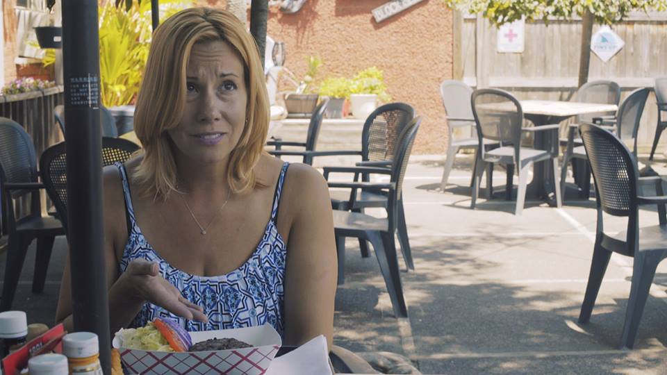 At lunch at a local eatery, Sharon complains about her under cooked burger and lack of almond milk - of course.