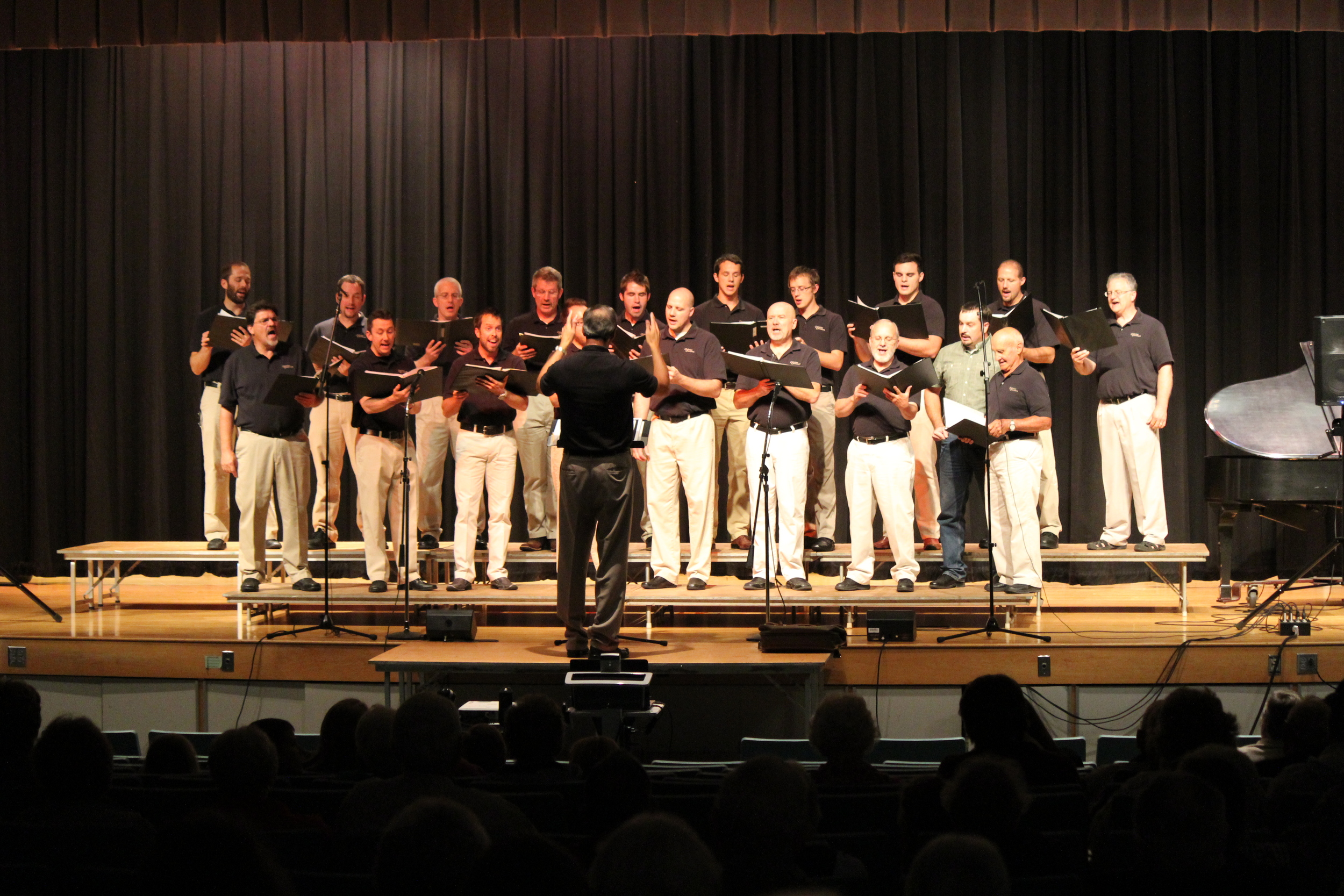  Former Christian Chorister Dennis Capela was invited on stage to sing with the group for one song (pictured front right). 