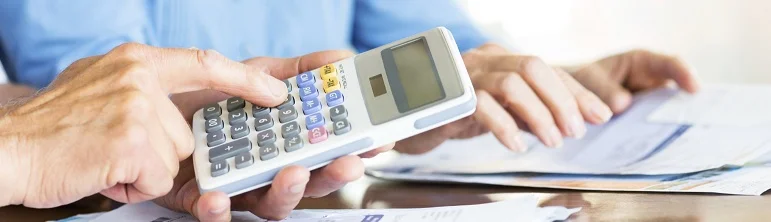 Senior Couple Calculating Domestic Bills.