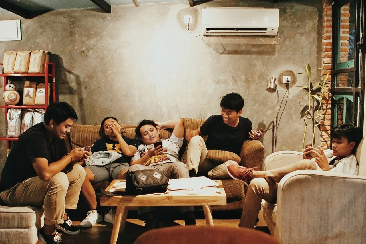 men-sits-of-sofa-1036804.jpg