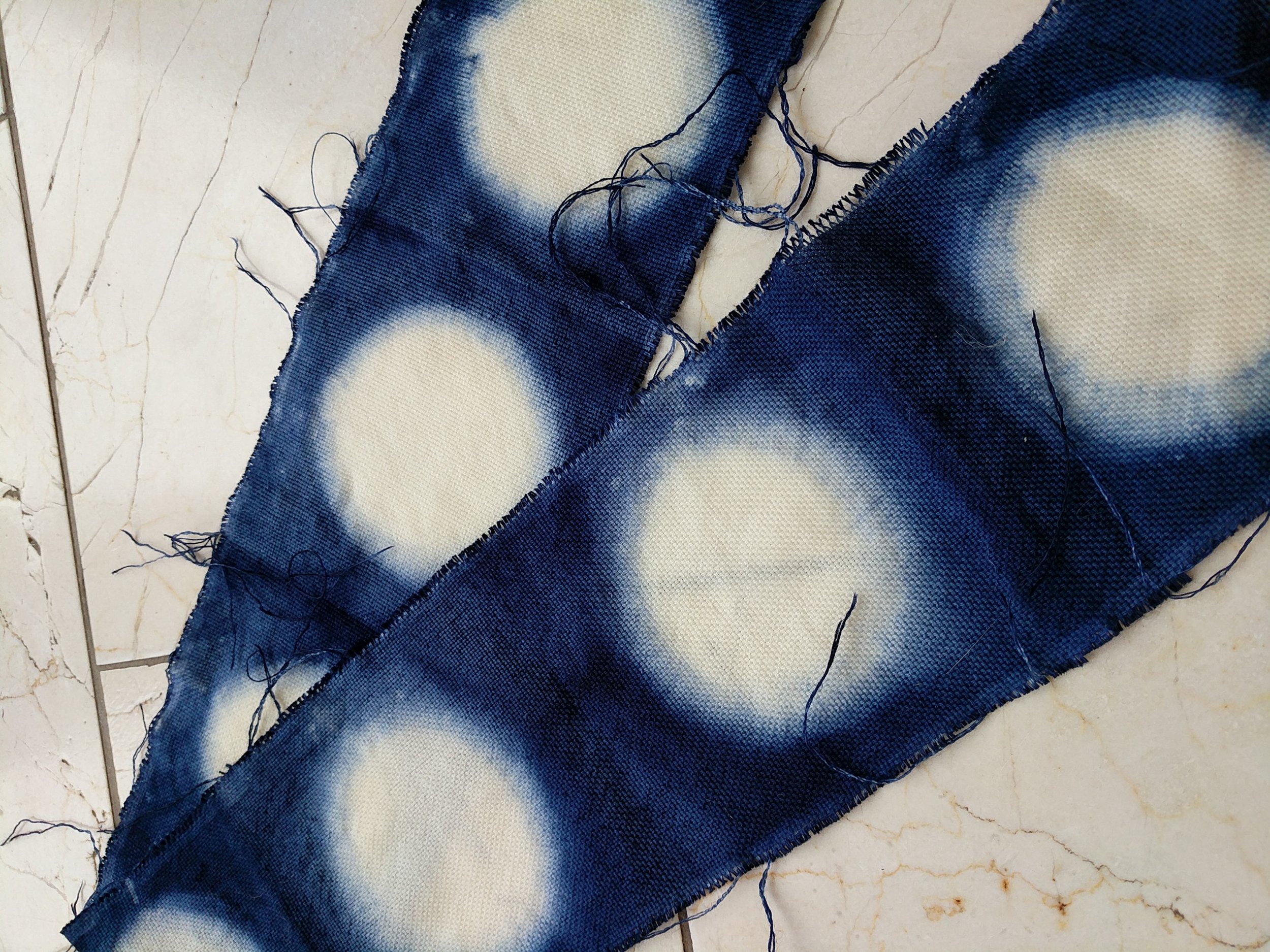 A simple Shibori attempt using a Jam lids and a clamp, tutorial to follow.