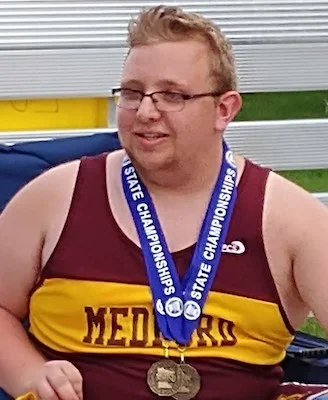 2018-19 MN Track & Field Discuss Throw Wheelchair Luke Johnston Medford Photo Credit: KRFO Radio