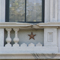 Bronze stars mark the scars on the State House left by union armaments during the shelling of Columbia.