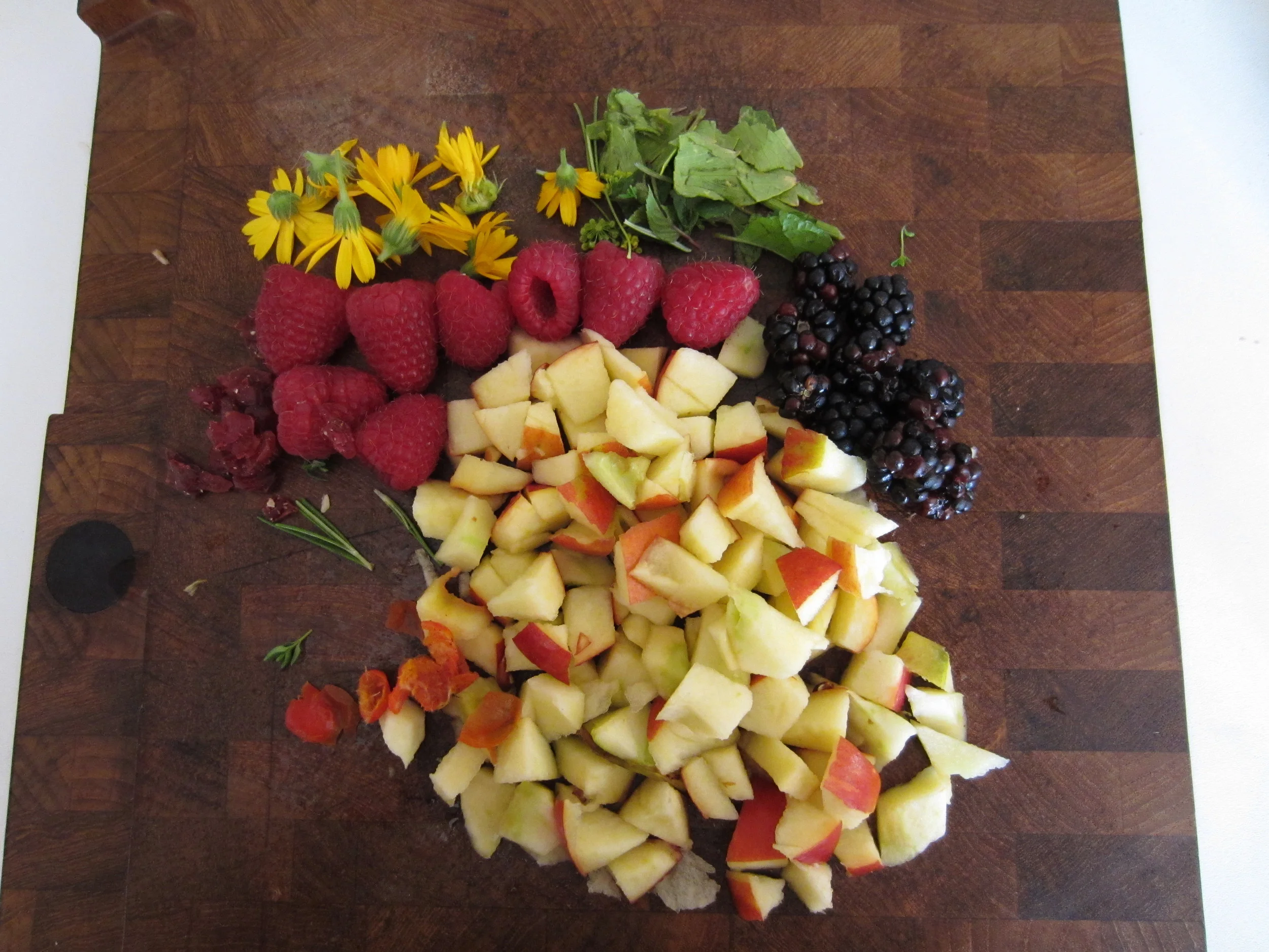 This morning I prepared some apples, raspberries, blackberries, cranberries, marigold leaves, a variety of herbs and some rose hips (remove seeds as they are poisonous) to go into freezer bags for the rest of the week. All of the above were grown in my garden.