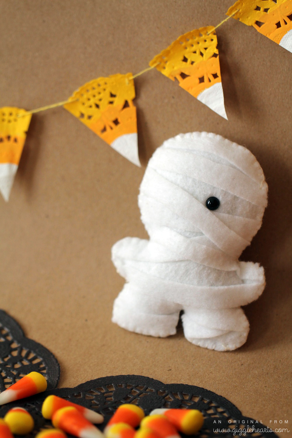 DIY Candy Corn Garland / shown with a Mummy Squatles / from www.GiggleHearts.com