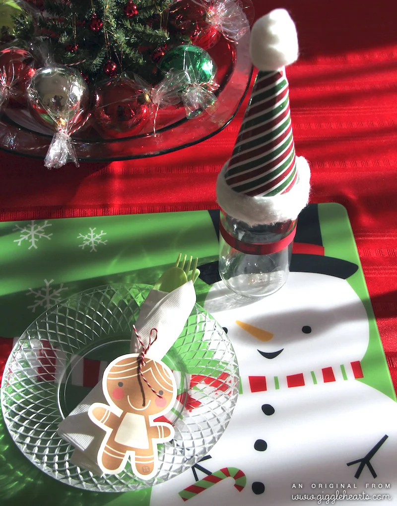 Cute Placesetting for Christmas with a Santa Hat Topping a Milk Glass with a Paper Belt / as seen on www.GiggleHearts.com