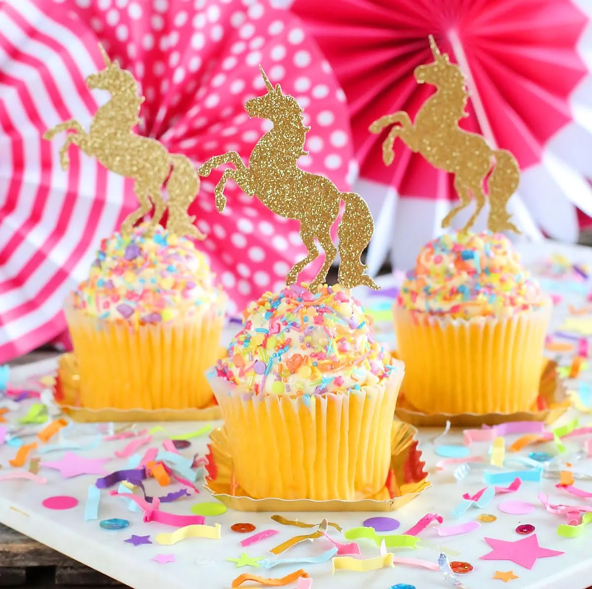 Colorful Unicorn Must-Have Party Items for a Perfectly Styled Unicorn Theme Dessert Table - Unicorn Cupcake Toppers, Sprinkles and Festive Fetti Confetti - from The Bakers Party Shop - see more on www.GiggleHearts.com