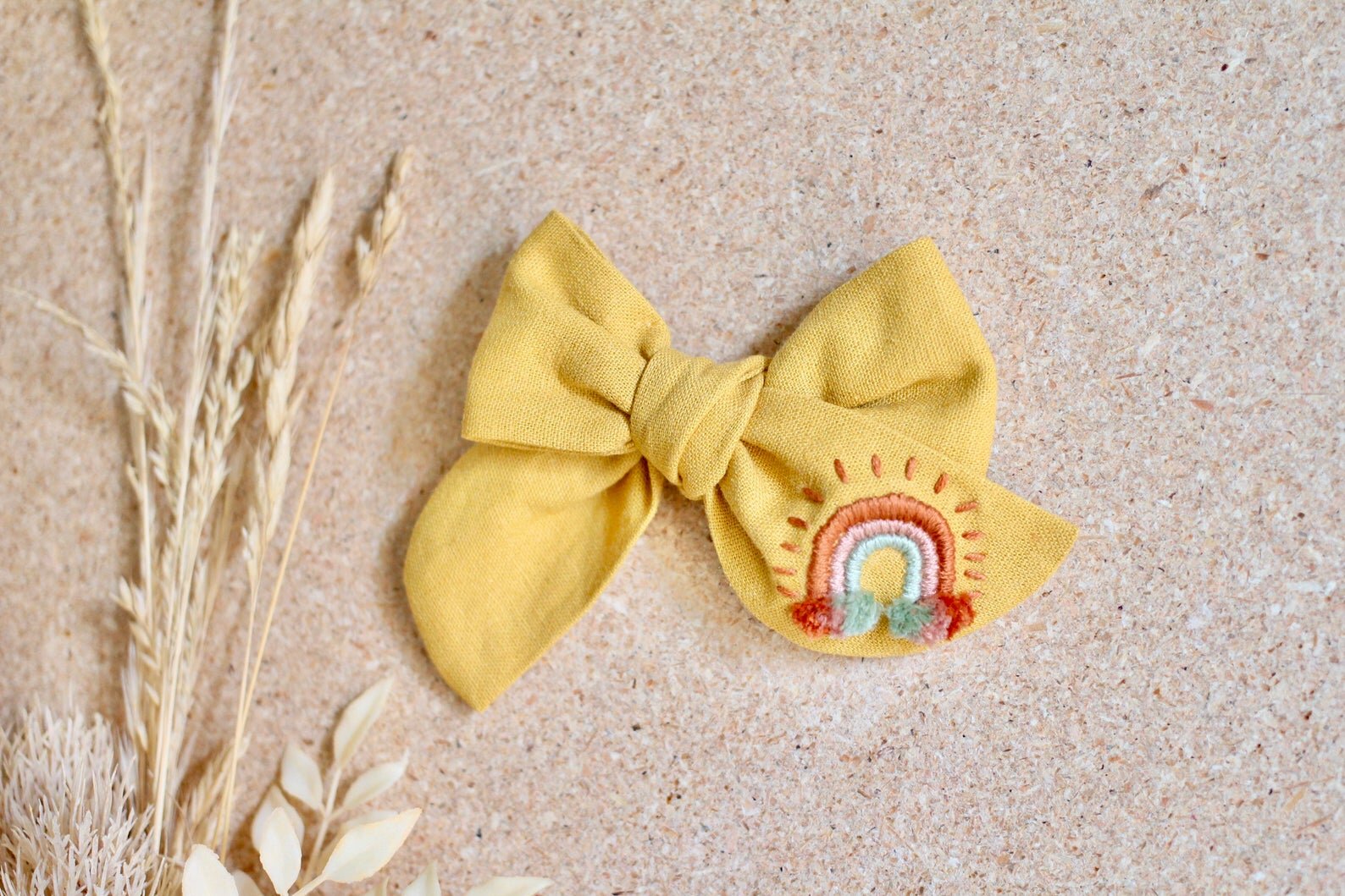 Sweet Little Berry creates Hand-Embroidered Bows.