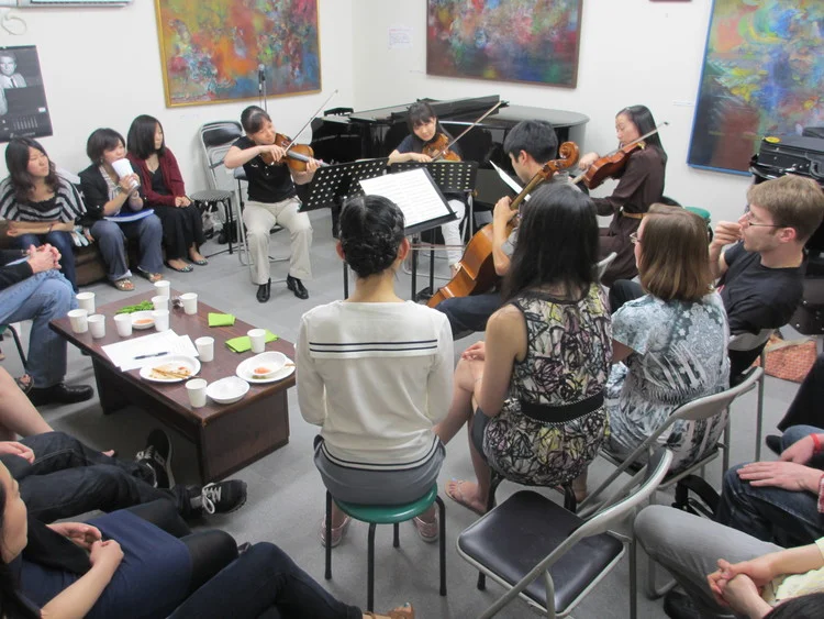 Artist party in a piano salon