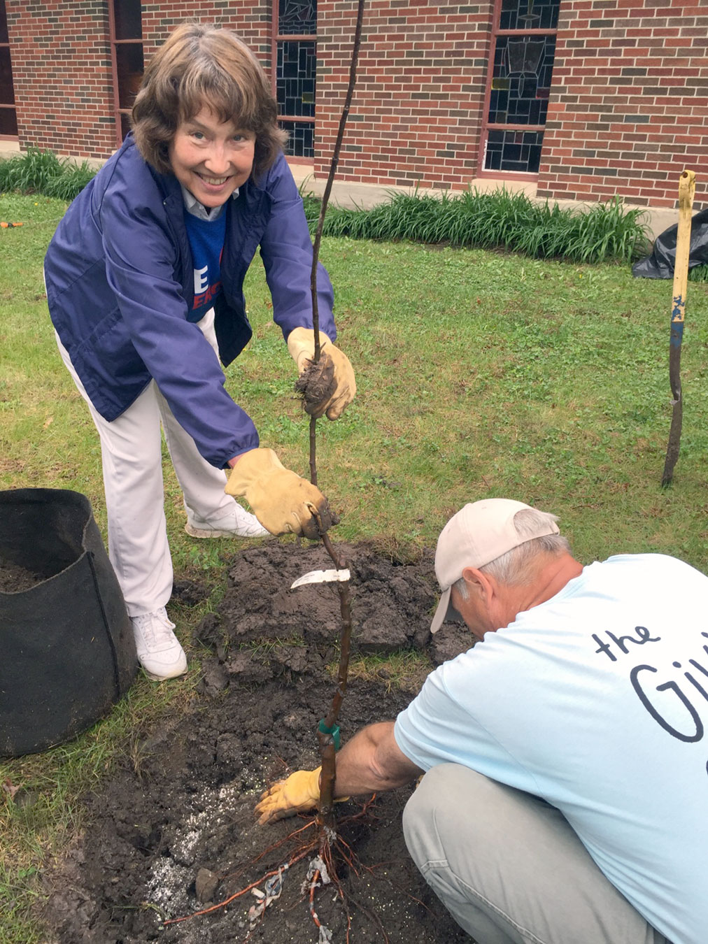  Elizabeth Cooper digs a hole. 