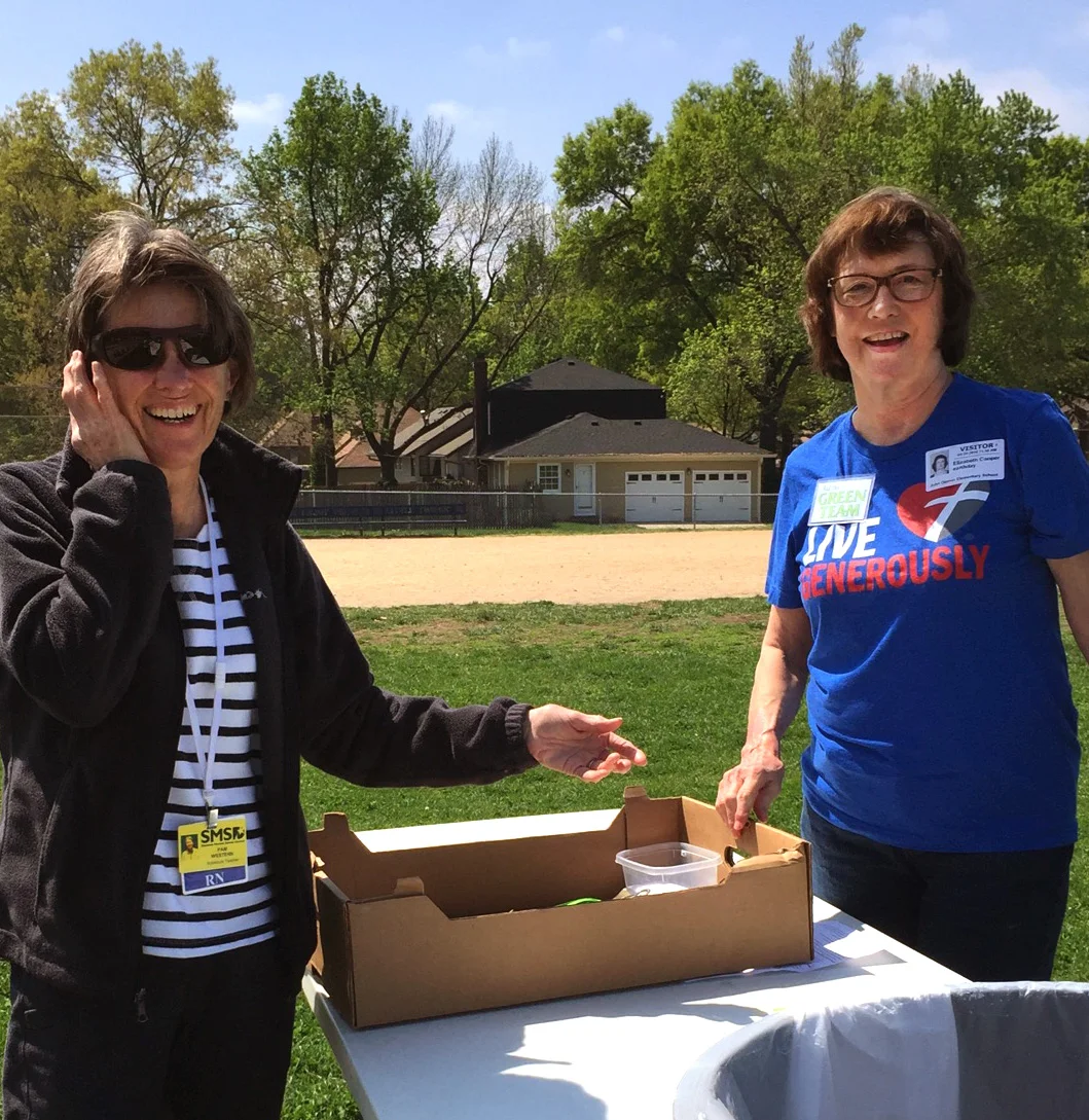 Pam Western and Liz Cooper help the children with packaging.