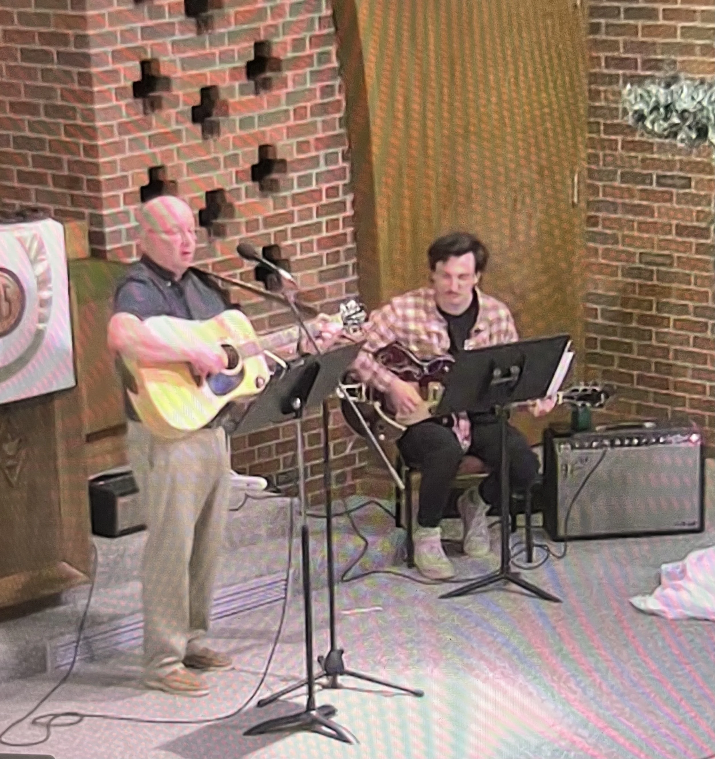 Ed and Jake leading a guitar service