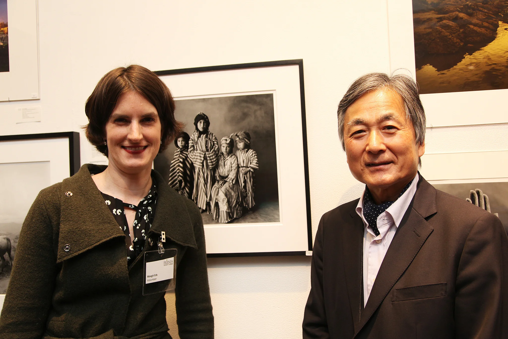 Founder of FWAB.org, Kenro Izu with volunteer Magarit Erb, photograph by Irving Penn in background.